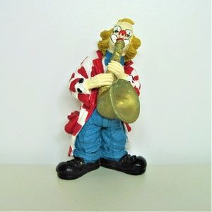 CLOWN FIGURINE PLAYING SAX